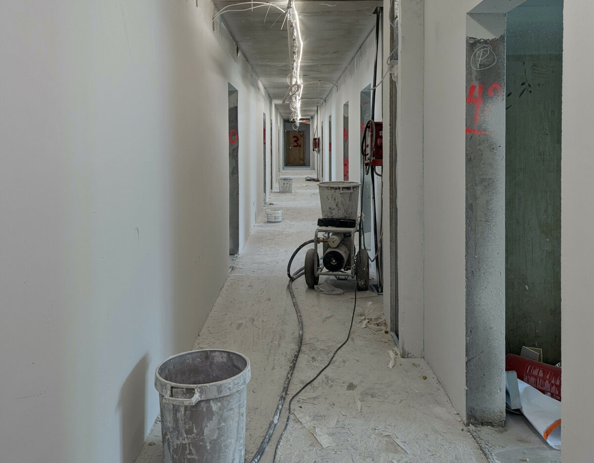 Construction site plastering phase — moisture monitoring