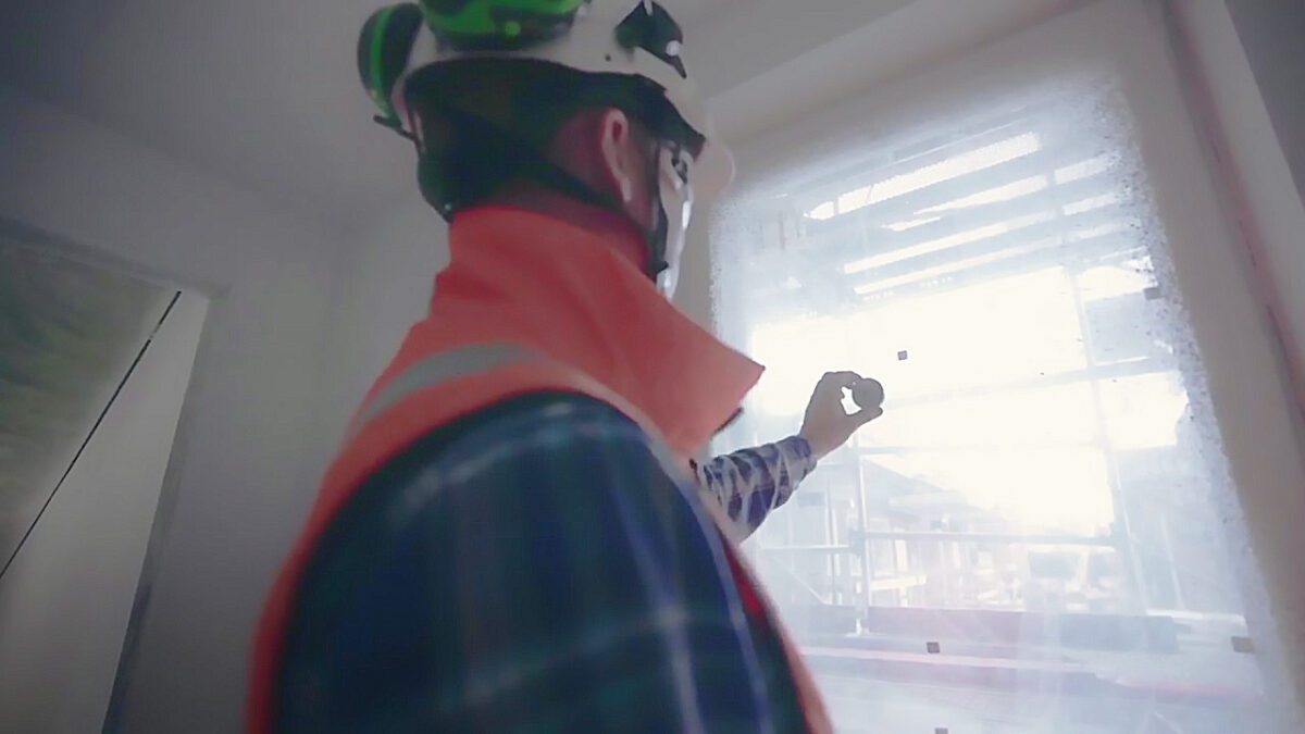 A worker installing a humidity sensor